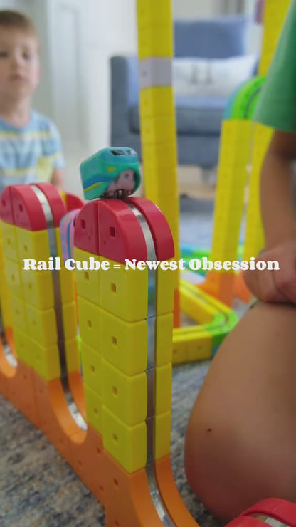 Magnetic cube track toy set with car in use on a colorful modular track